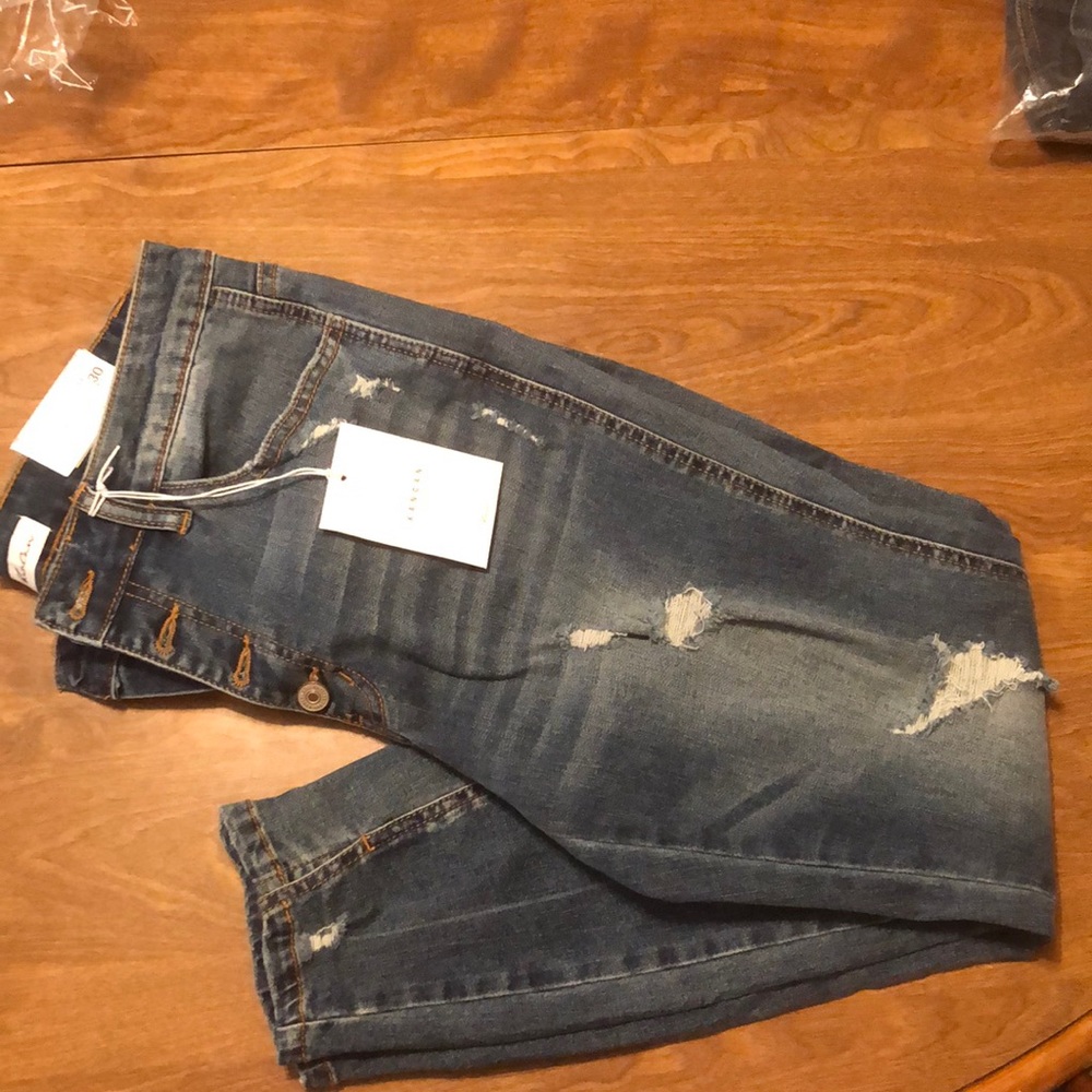 13/30 high waist skinny jeans with slit ankles.